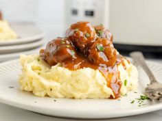 a plate with mashed potatoes covered in gravy