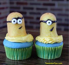 two cupcakes with yellow frosting and googly eyes are sitting next to each other