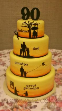 a three tiered cake with the silhouettes of people on it