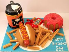 a birthday cake made to look like a hot dog and fries