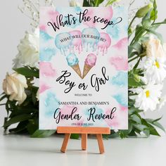 an ice cream themed baby shower sign with flowers and greenery in the back ground