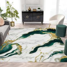 a living room with marble flooring and green rugs on the floor in front of a couch