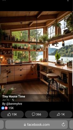 a kitchen filled with lots of wooden furniture next to a window covered in potted plants