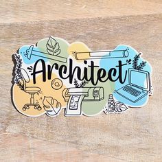 a sticker with the word architecture written in black ink on top of a wooden surface