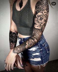 a woman with tattoos on her arms and arm