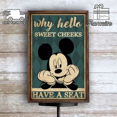 a sign that says why hello sweet cheeks have a seat with mickey mouse on it