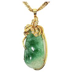 Introducing our stunning Vintage Carved Natural Jadeite Jade and Diamond Pendant, crafted in 14K yellow gold. The pendant features a translucent green on white jadeite jade, intricately carved with a unique vintage design. The jadeite jade is a highly prized gemstone known for its beauty, durability and rarity. The pendant is accented with 14 round diamonds, approximately 0.11ct, and one round diamond, approximately 0.005ct, adding an extra touch of sparkle and elegance. The pendant has a weight of 5.1g and dimension of 4.3x1.8x0.5cm, making it a substantial yet delicate piece of jewelry. It is stamped with 14K 585 to indicate that the gold is 14K. This pendant comes with a 22K yellow gold chain, weighting 7.4g and with a length of 16 inches, which is perfect to showcase the pendant. The c Jade Carving, Yellow Gold Chain, Jade Stone, Jade Pendant, Diamond Pendant Necklace, Burmese, Rarity, Bright Green, Diamond Pendant