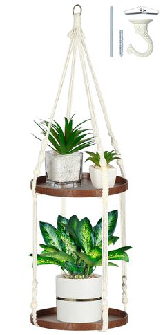 three tiered plant stand with potted plants on top and hanging from the ceiling