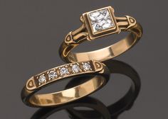 two gold wedding rings with diamonds on top of each other, one has a princess cut diamond in the middle