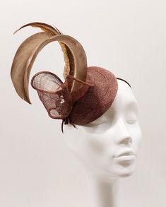 Unique handmade fascinator made of sinamay in light brown with big 2 feathers It has elastic band and is one size fits all. Elegant Adjustable Fascinator With Ostrich Feathers, Fitted Brown Costume Hats And Headpieces For Party, Fitted Brown Costume Hats For Party, Fitted Brown Costume Hats For Kentucky Derby, Adjustable Brown Mini Hats For Parties, Brown Fascinator For Kentucky Derby Party, Adjustable Brown Headpieces For Wedding, Elegant Adjustable Ostrich Feather Fascinator, Adjustable Brown Fascinator For Party