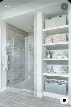 a walk in shower sitting inside of a bathroom