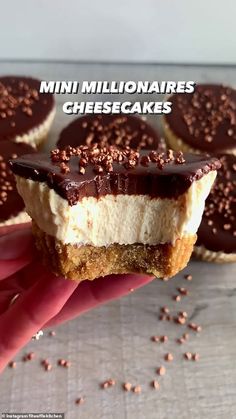 mini cheesecakes are being held up in front of the camera with chocolate sprinkles