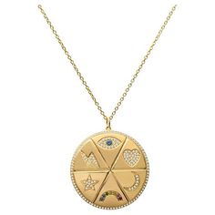 A 14 karat yellow gold medallion necklace featuring an evil eye, heart, moon, rainbow, star, and lightning bolt accented in diamonds and gemstones. It is set on an adjustable 17.5" chain. Measurements: Circumference approximately 28mm Symbolic Diamond Medallion Necklace, Celestial Multi-stone Gold Jewelry, Gold Medallion Necklace, Moon Rainbow, Heart Moon, Gold Medallion, Rainbow Star, Medallion Necklace, American Diamond