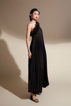 This dress is a must-have for your next vacation. The unique trapezoid pleating adds a touch of elegance to this floor-length dress, making it perfect for any special occasion. The lightweight organza fabric will keep you cool and comfortable, allowing you to fully enjoy your vacation. Chic Pleated Evening Maxi Dress, Chic Pleated Maxi Length Evening Dress, Chic Pleated Maxi Dress For Gala, Chic Maxi Length Pleated Evening Dress, Floor-length Pleated Evening Dresses, Evening Floor-length Pleated Dress, Gala Maxi Dress With Pleated Bodice, Chic Floor-length Pleated Dress For Party, Cocktail Maxi Length Pleated Evening Dress