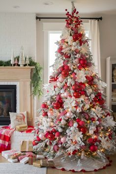 a decorated christmas tree with red and white ornaments