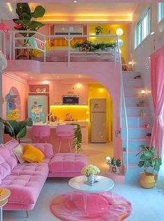 a living room filled with pink furniture and lots of plants on top of the stairs