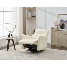 a white recliner chair sitting on top of a rug in a living room next to a window