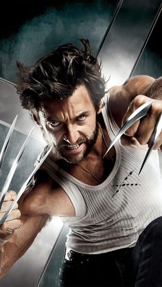 the wolverine man is holding two large scissors