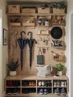 an organized closet with shoes and umbrellas