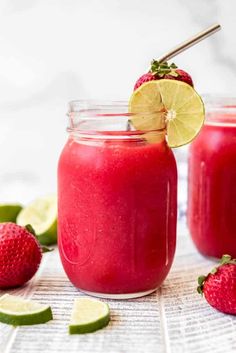 two mason jars filled with raspberry limeade