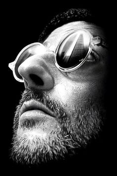 the poster for leon - der profi, which features a bearded man wearing sunglasses