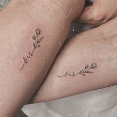 two people with tattoos on their legs sitting next to each other and one has the word love written in cursive writing