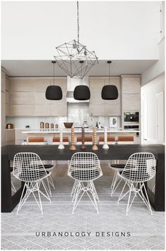 an image of a modern kitchen setting with chairs