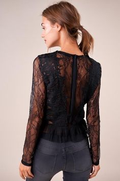 The Temptress is a sheer lace top covered in a floral design. The top features a high neckline, long fitted sleeves, and a darted bodice with a cropped, pleated hem. This ultra-sultry number is perfect for showing off your midriff in jeans and heels. Model is 5'9" and wearing size small. Pre-Order Now! Estimated Shipping Date October 25, 2019. Available in black. 100% polyester. Imported. Sheer Lace Top, Fitted Sleeves, October 25, High Neckline, Sheer Lace, Long Sleeve Lace, Pre Order, Bodice, Lace Top