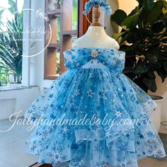 ♥ Introducing our enchanting blue dress adorned with delicate floral patterns, designed specifically for little girls who dream of embodying the elegance of their favorite princess, Elsa from Frozen. This exquisite dress features a captivating combination of blue, pink, and white hues, creating a magical appearance that is sure to delight any young girl. ♥ The sleeveless design is complemented by a unique style on the chest, while a large, eye-catching bow at the back adds a touch of charm and s Blue Tulle Princess Dress For Party, Elegant Light Blue Tutu Dress For Dress-up, Blue Floral Applique Wedding Dress, Blue Wedding Dress With Floral Applique, Fitted Blue Princess Dress With Floral Applique, Light Blue Tulle Party Dress, Blue Princess Pageant Dress, Blue Princess Dress In Glitter Tulle, Princess Style Blue Glitter Tulle Dress