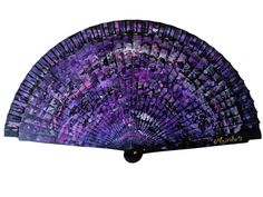 a purple and black hand fan on a white background