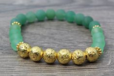 Check out this item in my Etsy shop https://www.etsy.com/listing/831843559/green-and-gold-lucky-stretch-bracelet Stone Gold, Lava Stone, Green Aventurine, Stretch Bracelet, Frosted Glass, Stretch Bracelets, Beautiful Bracelet, Green And Gold, Arm Band