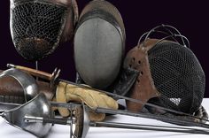 an assortment of old and new items on a white tablecloth, with one worn out