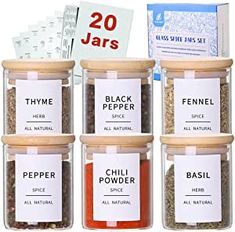 six jars filled with different types of spices