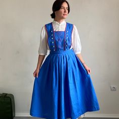 "Amazing unique vintage Austrian cross back cotton dress/pinafore with cute details and embroidery.  **Material: cotton.  **Good vintage condition. Has some signs of wear on the fabric.  ** Size 40/42. Please see measurements ( lying flat): waist-40cm/15,7\" full length-127cm/50\" skirt length-85cm/33,5\" Model is size M and 170 cm growth. **This item will come to you freshly laundered and ready to wear. **If you want to purchase more items, please message me, I will make a special price and del Cotton Pinafore Dress For Daywear, Vintage Cotton Pinafore Dress For Spring, Blue Sleeveless Casual Pinafore Dress, 50 Skirt, Vintage Fitted Pinafore Dress, Vintage Cotton Pinafore Dress With Pockets, Blue Pinafore Dress, 70s Pinnafore Dress, Pinafore Apron Dress