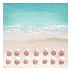 an aerial view of beach umbrellas and the ocean