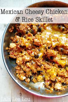 mexican cheesy chicken and rice skillet in a bowl on a wooden table