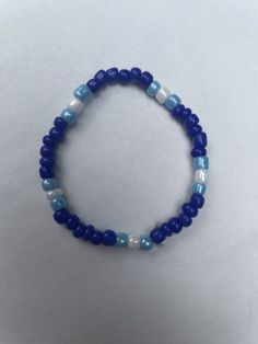 The Deep Blue Waters Bracelet is a bracelet made of seed beads. This comes in a set of 1. Casual Turquoise Spacer Beads, Blue Stretch Bracelet With Colorful Beads, Blue Stretch Bracelet With Polished Beads As Gift, Blue Beaded Stretch Bracelet With Round Beads, Gift Blue Stretch Bracelet With Polished Beads, Blue Polished Beads Beach Jewelry, Blue Polished Beads For Beach, Blue Polished Beads Jewelry For Beach, Blue Polished Beads Bracelets For Gift