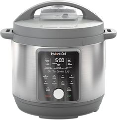 an electric pressure cooker with the timer on it's side and lid open