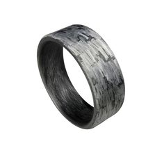 THE RING - This ring has a modern flat Texalium Silver band with a Black Carbon Fiber interior. The matte finish is extremely durable and scratch resistant. Each ring is individually handcrafted giving you a one of a kind piece. SIZING - All of our rings are made according to US Sizing and are standard fit rings. However, the band width can affect how the ring will fit. The wider band widths will sit on the fattier part of the finger making it feel tighter. We recommend with a 9mm or 10mm band width you go up half size from what you normally wear. PROPRIETARY NASA TECHNOLOGY IN EVERY RING - Having decades of experience with carbon fiber and composites, we invented a unique process for NASA that we use in every Core Carbon Ring made. The process allows for an extremely strong, lightweight, Carbon Ring, Carbon Fiber Rings, Modern Flat, Carbon Black, Wide Bands, Silver Band, Unique Rings, Carbon Fiber, Band Rings