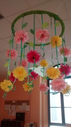 some paper flowers are hanging from the ceiling