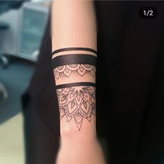 a woman's arm with a tattoo on it that has an intricate design in the middle