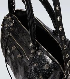 Material: leather.Lining: fabric.Made in Italy.Designer color name: Black.Closure: zipped top.Top handle, Detachable shoulder strap.Zipped front pocket.Internal details: internal zipped pocket.Adjustable length.Height 27cm-10.5'.Width 40cm-15.5'.Max. depth 22cm-8.5'.Length of handles 51cm-20'.Max. length shoulder strap 124cm-49' Designer Leather Shoulder Bag With Zipper, Designer Leather Shoulder Bag With Zipper Closure, Designer Bags With Zipper For Daily Use, Designer Travel Bag With Zipper Closure, Black Leather Satchel With Zipper Pocket, Designer Satchel Shoulder Bag With Zipper, Designer Satchel Shoulder Bag With Zipper Closure, Designer Satchel Shoulder Bag With Zipper Pocket, Designer Shoulder Bag Satchel With Zipper Pocket