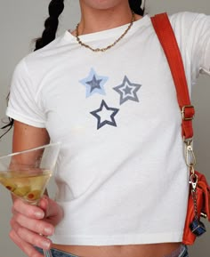 Embrace the nostalgia of the Y2K era with our Blue Denim Star Baby Tee. This Downtown Girl Aesthetic top exudes 90s vibes and captures the essence of a Vanilla Girl's wardrobe. Perfect for the Gen Z crowd looking for Preppy Stuff with a touch of cute Teenage Girl charm. Ideal as a stylish and unique gift for the fashion-forward individual. 🖤 100% USA cotton (Note: Sports Gray color variation features 90% Cotton & 10% Polyester) 🖤 Ribbed knit, crew neckline, and tear away label 🖤 90s style bab Star T Shirt Aesthetic, Trendy Blue Star Print Top, Trendy Blue Top With Star Print, Fitted Blue Top With Star Print, Blue Star Print Top With Relaxed Fit, Vanilla Girl Clothes, Downtown Girl Aesthetic, Preppy Stuff, Y2k Era