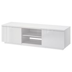 a white entertainment center with an open door and shelves on each side, in front of a white background