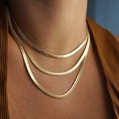 This vintage-inspired Retro Snake Chain Necklace has all those 90s vibes we love! This piece can be easily mixed and matched with other pieces for a curated look. Add a Retro Rope Chain or a delicate clavicle choker - it's the perfect starting point for all your layering looks. DETAILS & SIZE Finish: 18k gold or silver plate Material: Stainless steel Measurements: Chain: 16" or 18" Lobster claw clasp Waterproof, tarnish-resistant, and nickel free Shop Necklaces for more options to layer this wit Gold Herringbone Chain, Triple Layer Necklace, Gold Collar Necklace, Herringbone Chain, Herringbone Necklace, 90s Vibes, Snake Necklace, Gold Collar, Chain Choker Necklace