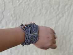 These gorgeous stretch bracelets are the perfect bohemian accent pieces to your collection. Bohemian Gray Beaded Jewelry, Handmade Bohemian Gray Beaded Bracelets, Adjustable Gray Bohemian Bracelets, Adjustable Bohemian Gray Bracelet, Wedding Bracelets, Wedding Bracelet, Stretch Bracelets, Accent Pieces, Beaded Earrings