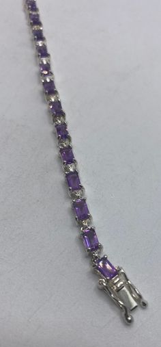 Vintage Amethyst Bracelet 925 Sterling Silver This genuine purple Amethyst is very lively and bright. The stones are deep colors and well matched. The 925 sterling silver is oxidized with age 7.5 inches for an average wrist My jeweler can shorten this for a $20 fee All jewelry is shipped free in the US in a nice gift box. Check out our over a THOUSAND great reviews!!! Engraving is $4 per letter and is not always perfect depending on the piece. It can take a few days if the jeweler is busy. This is payable to Paypal Judithsltd@gmail.com Formal Purple Amethyst Sterling Silver Bracelet, Silver Amethyst Tennis Bracelet With Gemstones, 1950s Bracelet, Mermaid Ring, Amethyst Bracelet, Heart Locket, Purple Amethyst, Arm Band, Diamond Bracelet