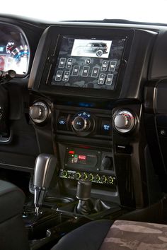 the interior of a car with various electronic controls and dashboards on each side of the vehicle