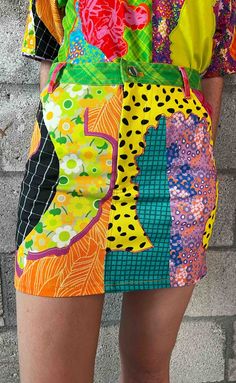 WARNING: May cause EXTREME joy! Use liberally! A limited edition run in Collaboration with Bahamian Artist Gio Swaby. SHIPS IMMEDIATELY! Classic 4-pocket Denim Mini Skirt in our "Gio Heads" Print! COMPOSITION & CARE Denim - Cotton: 99%, Spandex: 2% Coated Black Shank Buttons Machine Wash Cold, Cool Iron, Tumble Dry Colorful Fits, 80s Trends, Clothing Manufacturing, Bright Colored Outfits, Maximalist Fashion, Dopamine Dressing, Sewing Workshop, Funky Outfits, Upcycled Fashion