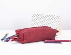 "The REC case in a soft pebbled deep red Italian cow leather and cotton floral interior. This pencil case was made to carry around your purse. It can fit easily 2 dozens or more pens inside. The top closes using a sturdy nylon zipper with brass hardware. Aprox. dimensions: The bottom is measuring 7\" x 5\" (18cm x 5cm) and the height of this pouch is 2.5\" (6cm). The last two images are showing the different sizes of the Rec case that are currently available in our shop and shown only for propor Pencils Case, Leather Pencil Case, Floral Interior, Brown Vintage, Accessories Bags Purses, Yellow Leather, Pencil Pouch, Colored Leather, Purse Pouch